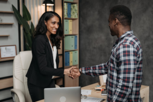 immigration attorney and client shaking hands