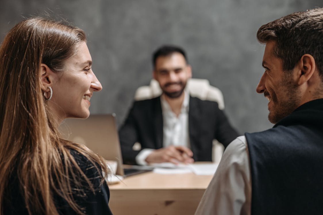 A happy reunited couple in a lawyer’s office