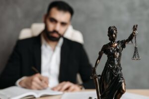 An experienced immigration lawyer with a statue on their desk