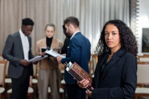 Immigration lawyer posing as her colleagues chat behind